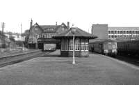 Platform view east at Possil in October 1964 shortly before closure. A DMU for Rutherglen is about to depart. The impressive 1897 station building stands facing Balmore Road in the background [see image 14982].<br><br>[Colin Miller /10/1964]