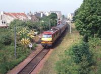 90026 stands at North Berwick in June 2004 with a train for Edinburgh Waverley. The operation of push-pull services on the branch, using class 90 electric locomotives hired from EWS and former Virgin Trains Mark 3 coaches, was used as a stop-gap measure necessitated by EMU shortages during 2004/2005.<br><br>[Bruce McCartney Collection /06/2004]
