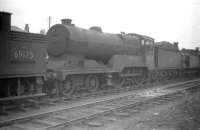 Robinson D11 no 62683 <I>Hobbie Elliott</I> stands on one of the 'stored' locomotive lines in the yard at Bathgate in April 1959. The 4-4-0 had been withdrawn from Haymarket shed approximately 7 months earlier.<br><br>[Robin Barbour Collection (Courtesy Bruce McCartney) 21/04/1959]