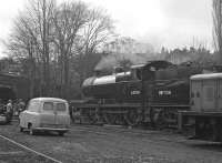 Once taken over by the KWVR the former goods yard at Haworth became a hive of activity on Sundays, as seen here. Fowler 4F No. 43924, one of the first Barry scrapyard escapees, is perhaps of less interest to some than JKY 912F, an Austin A55 van (or is it the Morris badged version?), which presumably has not survived. Thought to be Sunday 28th March 1976.<br><br>[Bill Jamieson 28/03/1976]