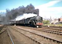 A2 Pacific no 60535 <I>'Hornet's Beauty'</I> does nothing for the view of the castle as it passes its home shed at Haymarket and heads west out of Edinburgh with a train for Aberdeen in the summer of 1959.<br><br>[A Snapper (Courtesy Bruce McCartney) 04/07/1959]