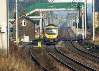 A pair of First TPE Class 185s on a Manchester Airport - Edinburgh service passing the site of Hest Bank station and level crossing on 28 January 2012.<br><br>[John McIntyre 28/01/2012]