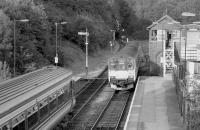 150014 arrives at Ledbury on 18 July 1997, while 156410 waits for the single line before heading east.<br><br>[Bill Roberton 18/07/1997]