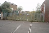 Deepdale Mill Street level crossing, disused since the last coal train ran in 1991, looking north east towards Deepdale Junction and Longridge. Behind the camera is the site of the Preston Coal Concentration Depot, which was in the original Preston and Longridge Railway terminus. The right hand track is in place all the way to the junction but the all pervading high security fencing was installed after the line closed.<br><br>[Mark Bartlett 22/09/2011]