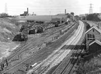 Lockes Sidings box on the right controlled the access off the ex-L&Y Calder Valley line into St John's colliery sidings at Normanton. Pre-nationalisation the mine had been owned by Locke & Co (Newland) Ltd, hence the signalbox name. Goose Hill Junction, where the L&Y met the MR, can be seen in the distance.<br><br>[Bill Jamieson 03/04/1976]