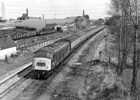 46002 with the 10.12 Newcastle - Cardiff on the former MR main line just south of Goose Hill Junction, Normanton, on 3 April 1976. It is about to pass Lockes Sidings signal-box, located on the adjacent ex L&Y main line to Wakefield and Manchester. [See image 38058]<br><br>[Bill Jamieson 03/04/1976]