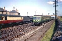 An Edinburgh - Glasgow InterCity DMU runs through Saughton Junction on 1 August 1957 passing a K3 2-6-0 with empty stock from Saughton carriage sidings heading for Waverley.<br><br>[A Snapper (Courtesy Bruce McCartney) 01/08/1957]