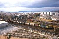 A trip freight from Invergordon (including first generation BR whisky containers) slows into Millburn Yard, Inverness, in 1977.<br><br>[Frank Spaven Collection (Courtesy David Spaven) //1977]