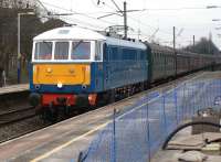 86259 <I>Les Ross</I> in original BR electric blue livery rushes through Leyland station on 4 February hauling the Railway Touring Company's <I>'Winter Cumbrian Mountain Express'</I> on the leg from Euston to Preston. From Preston the special would head for Carlisle via the S&C behind Black 5 no. 45305, returning via Shap to Carnforth where the 86 would take over once more for the return to Euston. [See image 37494]<br><br>[John McIntyre 04/02/2012]