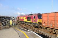 EWS 67025 runs through Didcot on 1 February with a northbound freight in the Oxford direction, thought to be heading for the MOD at Bicester.<br><br>[Peter Todd 01/02/2012]