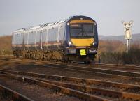 170411 catches the low sunshine on 5 February as it passes Thornton Junction with the 15.25 from Perth to Edinburgh. At right, the Methil branch and its signal disappear into the undergrowth.<br><br>[Bill Roberton 05/02/2012]