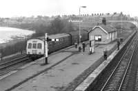 An afternoon Alston branch DMU, with class 101 power car No. E51437 leading, awaits a connecting service off the Carlisle - Newcastle line before setting out from Haltwhistle in March 1976. <br><br>[Bill Jamieson 27/03/1976]