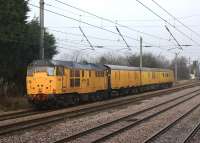 A Network Rail test train propelled by 31602  <I>Driver Dave Green</I> heads north on the Down Slow line at Euxton on 6 February 2012. The train was braking for a signal check due to Preston PSB slotting in a down Northern service off the Chorley line across in front of it at Euxton Junction.<br><br>[John McIntyre 06/02/2012]