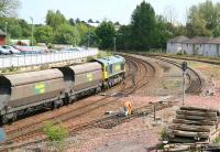 View south from Annan Road bridge, Dumfries, on a hot and humid 20 May 2008. A coal train hauled by Freightliner 66551 is passing the meagre remains of Dumfries south sidings [See image 4633].<br><br>[John Furnevel 20/05/2008]