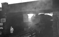 <I>See and be seen!</I> A Kilmarnock bound stopping train overtakes a 'pedestrian' just prior to arrival at Ardrossan South Beach station on 25 May 1963. Fairburn 2-6-4T no 42190 is passing below the bridge carrying South Beach Road.<br><br>[R Sillitto/A Renfrew Collection (Courtesy Bruce McCartney) 25/05/1963]