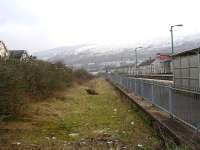Looking towards Pontyridd along the disused Maerdy branch face of the former island platform at Porth Station. A replacement ticket office is proposed for this side of the station, to avoid Cardiff bound passengers coming from the station car park having to cross over the line to purchase tickets. <br><br>[David Pesterfield 31/12/2011]