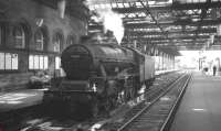 Jubilee 45605 <I>Cyprus</I> makes an unusual sight standing at platform 4 of Newcastle Central on 23 June 1962. The Holbeck locomotive had worked in on the 9.30am from Manchester Exchange. After a brief visit to Gateshead shed, the Jubilee returned south later the same day with the summer Saturday 1.00pm Craigendoran - Leicester (London Road).<br><br>[K A Gray 23/06/1962]