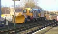 The first visit of a class 20 to Kilmarnock on a service train for some time. DRS 20303 operating in tandem with 7Z57 on snow ploughs to Carlisle, shortly after leaving Brodie Engineering, Bonnyton, on 10 January 2012.<br><br>[Ken Browne 10/01/2012]