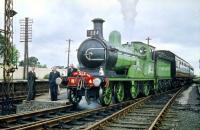 The SLS <I>'Golden Jubilee Special'</I> makes a photostop at Symington station on 13 June 1959. Ex-Great North of Scotland Railway 4-4-0 No 49 <I>Gordon Highlander</I> is at the head of the train.<br><br>[A Snapper (Courtesy Bruce McCartney) 13/06/1959]