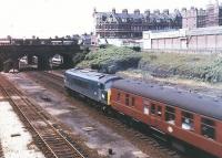 The Midland main line 3 miles out of St Pancras in June 1969. A 'Peak' is about to take a semi-fast for Nottingham under the bridge carrying West End Lane. The station on the other side of the bridge was named 'West Hampstead Midland' at that time, one of the six names it carried following its opening in 1871. In 1988 it was renamed 'West Hampstead Thameslink'. Within 200 yards of here, on the same street, are two other stations, one serving the Jubilee Line - called West Hampstead, the other serving the North London Line, this one called.... West Hampstead. The words <I>'West Hampstead station please...'</I> were never popular with London taxi drivers. [See image 5248]    <br><br>[John Furnevel 17/06/1969]