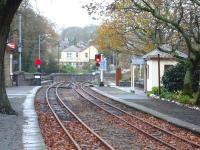 View along Minffordd Ffestiniog Railway station looking towards Porthmadog. The National Rail totem is just visible in the left background, marking the entrance ramp to the subway under the FR tracks, whichs gives access to the low level Arriva Trains Wales platform.<br><br>[David Pesterfield 08/12/2011]