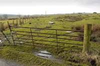 A little to the south of Steelend Goods Station itself is the site of the exchange sidings that once served Bandrum Colliery, located just over a mile to the west. The fence on the left marks the course of the line. The pit was sunk in 1907 but abandoned three years later due to geological problems. Photographed in January 2012. <br><br>[Bill Roberton 30/01/2012]