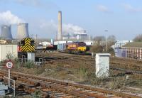 66037 waiting with containers at Didcot on 1 February 2012, about to depart eastbound for Southampton.<br><br>[Peter Todd 01/02/2012]