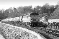 56096 hauls empty coal hoppers from Longannet Power Station along the sea wall at Culross in July 1998. Dunimarle Castle stands in the background.<br><br>[Bill Roberton /07/1998]