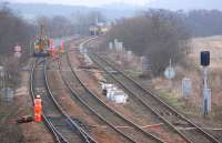 Renewal of the down main line at Inverkeithing East Junction on 12 February 2012, one of a number of major PW projects being carried out simultaneously during line closure. 66096 lurks in the background.<br><br>[Bill Roberton 12/02/2012]