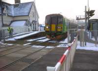 The 15.18 to Bedford has just crossed the 15.20 to Bletchley at the little-used station at Ridgmont (despite the massive Amazon warehouse located behind the camera). The road bridge in the background has vastly reduced road traffic queues at this level crossing, which is close to Junction 13 of the M1.<br><br>[Ken Strachan 10/02/2012]