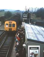 Crowds celebrate the first day of re-opening at Kingsknowe station on 1 Feb 1971. The station, opened in 1848 (originally as King's Knowes), had been closed by BR in July 1964. The red notice in the cab window of the Waverley bound DMU reads <I>'Kingsknowe station reopens today'</I>.<br><br>[David Spaven 01/02/1971]