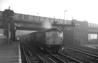 A slight haze seems to hang over Carlisle station in the early afternoon of Saturday 28 December 1968. At platform 7 the 1.00pm service for Edinburgh Waverley via Hawick is about to depart behind D5337.<br><br>[K A Gray 28/12/1968]