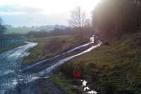 The site of the level crossing at Lathalmond looking back south west towards Gask Junction in February 2012 [see image 37642]. The embankment that carried the Steelend branch can be seen in the left centre background.<br><br>[Grant Robertson 12/02/2012]