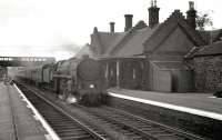 An up express hauled by a Standard <I>Clan</I> Pacific runs through Beattock station in July 1962.<br><br>[R Sillitto/A Renfrew Collection (Courtesy Bruce McCartney) 14/07/1962]