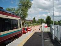 Newly re-opened Alloa sees 170474 standing in the platform road while the freight only line to Longannet and beyond runs behind. At this early date it was projected that the new line would carry 155,000 passengers in its first year. In fact the trains were used by 400,000 poeple and frequencies and destinations were quickly increased - a real success story.<br><br>[Mark Bartlett 29/05/2008]