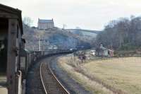 EE Type 4 No. 367 leaves a blue haze over Hilton Junction on 3 March 1971 with the afternoon Millerhill to Inverness freight. The train, complete with extra brake vans conveying members of the EURS, is about to join the ex CR main line and follow the preceding Glasgow - Dundee passenger train into Perth [see image 37572].<br><br>[Bill Jamieson 03/03/1971]