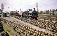 A fine July day at Saughton Junction in 1959 sees Bathgate shed's J36 0-6-0 no 65341 passing with an eastbound oil train.<br><br>[A Snapper (Courtesy Bruce McCartney) 31/07/1959]