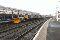 DRS class 57s 57004+57009 take 7Z57  two snow ploughs out of Brodie Works Kilmarnock en route to Carlisle and ultimately Doncaster<br><br>[Ken Browne 02/02/2012]