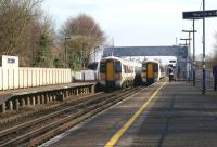 Two Southeastern services call at Minster on 23 February 2012. On the left is a late running train from Ashford heading for Ramsgate and on the right a Ramsgate - London Charing Cross service.<br><br>[John McIntyre 23/02/2012]