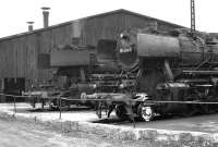 DB class 50s, Nos. 052 185 and 051 899 standing adjacent to the roundhouse at Schwandorf MPD in August 1974. Schwandorf  is an important junction on the Regensburg to Hof main line, although much of the local freight work, which in 1974 still required a fleet of class 50s to operate, has  now disappeared.<br><br>[Bill Jamieson 25/08/1974]