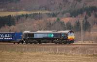 DRS 66423 with the 4D47 Inverness - Mossend intermodal service just south of the former Dalguise station on 25 February 2012.<br><br>[Bill Roberton 25/02/2012]