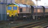 Freightliner Heavy Haul 66544 takes loaded HHAs from Killoch out of Kilmarnock on 2 February 2012. Train 6M32 is destined for Drax Power Station.<br><br>[Ken Browne 02/02/2012]