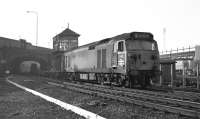 Class 50 No. D405 brings an eastbound Freightliner cautiously past St. Margarets box, preparatory to stopping at the up starter. The section ahead to Craigentinny was occupied by a preceding train, probably the football special ECS hauled by D6102, which would be entering the carriage sidings [see image 27804]. <br><br>[Bill Jamieson 28/02/1970]