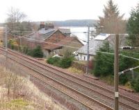 Site of the former station at Cobbinshaw, South Lanarkshire, (closed April 1966) on the Caledonian route between Carstairs and Edinburgh. Photographed looking north east from the unclassified road over the line on 28 February 2012. The expanse of Cobbinshaw reservoir stands beyond.<br><br>[John Furnevel 28/02/2012]