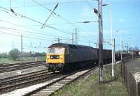 Brush Type 4 47280 brings a freight off the East Lancashire line onto the Up WCML at Farington Junction in May 1980. The former D1982 continued in service for a another 19 years until withdrawal from Bescot, and then languished in storage for a further eight until scrapped at EMR Kingsbury in December 2007. The shiny track in the foreground led to the two loco exchange sidings where electric locos would wait for southbound freights but they later fell into disuse. In 2012 however they were used again on consecutive February Saturdays to hold 86259 <I>Les Ross</I> waiting to take over from steam on the returning <I>'Cumbrian Mountain Express'</I>. [See image 38393] <br><br>[Mark Bartlett 02/05/1980]