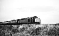 Scene near the former Orbliston station (closed 1964) between Elgin and Keith on 18 January 1979, with EE Type 4 no 40074 passing on a mid-afternoon Inverness - Aberdeen train.<br><br>[Peter Todd 18/01/1979]