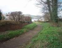 A view down the 1:35 gradient on the old Campbeltown and Machrihanish trackbed, now a public footpath, looking towards the sea loch. This location is just east of the site of the long gone depot and eighty years after closure is one of the few visible sections of the old line. [See image 33469] for a map showing the location in 1921.<br><br>[Mark Bartlett 26/03/2011]