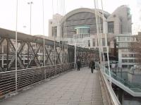 The platforms at Charing Cross station extend out over the River Thames on the Hungerford Bridge and there is a close up view of proceedings from the Jubilee footbridges that run either side of the railway bridge. However, the elevated view of this rebuilt station and its approaches is much better. [See image 25200].<br><br>[Mark Bartlett 07/02/2012]