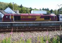 EWS 67009 photographed at Fort William on 27 July 2011 with the stock of the Caledonian Sleeper.<br><br>[John Steven 27/07/2011]