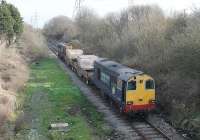 Having reset the Heysham Power Station ground frame for the passenger line the DRS guard is back aboard the idling 20308 and sister 20309 accelerates away towards Morecambe where the flask train will reverse and head for Sellafield. [See image 38034]<br><br>[Mark Bartlett 06/03/2012]